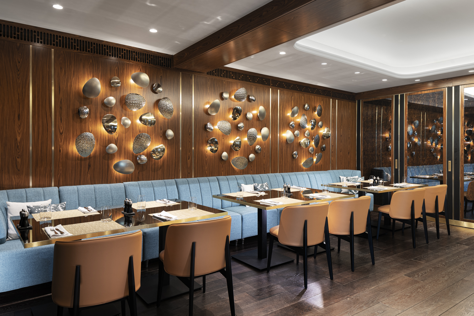 Warm restaurant lighting with soft tones creating a welcoming atmosphere.